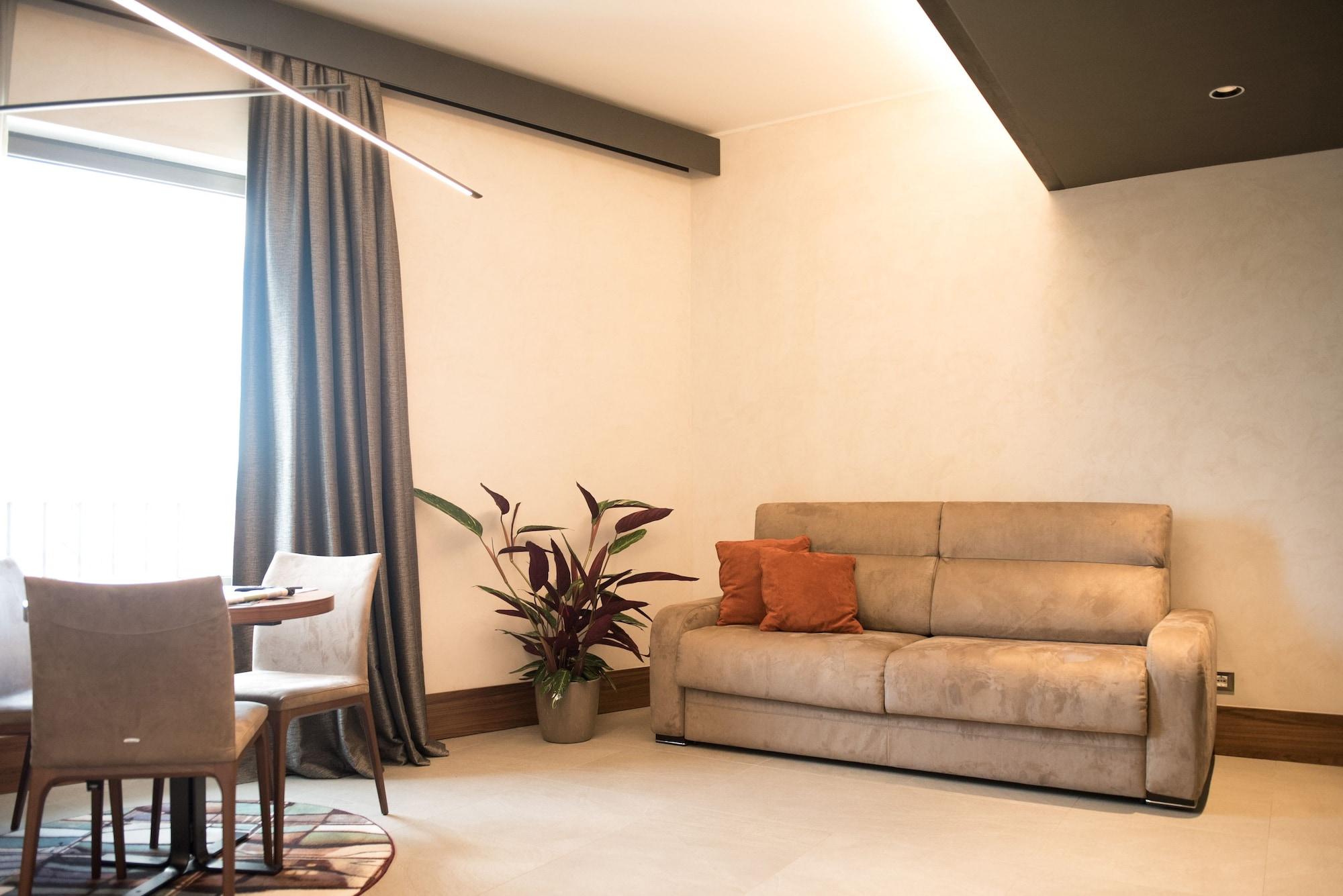 Gasometer Urban Suites Rome Exterior photo A living room with a sofa