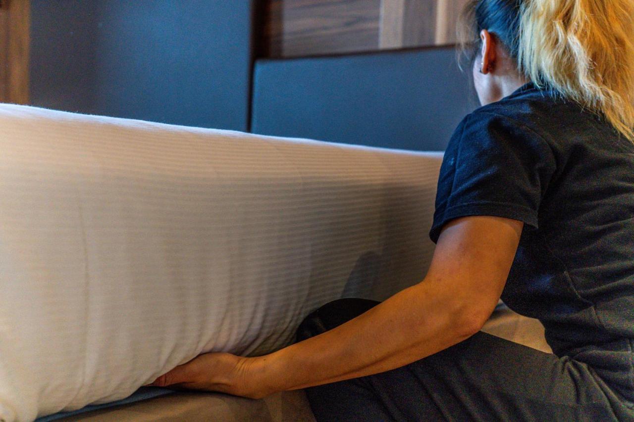 Gasometer Urban Suites Rome Exterior photo A hotel housekeeper making a bed