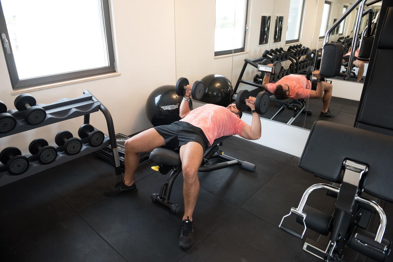 Gasometer Urban Suites Rome Exterior photo Dumbbell bench press